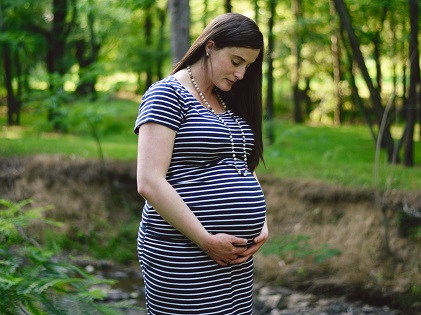 woman wearing stripes maternity pregnant