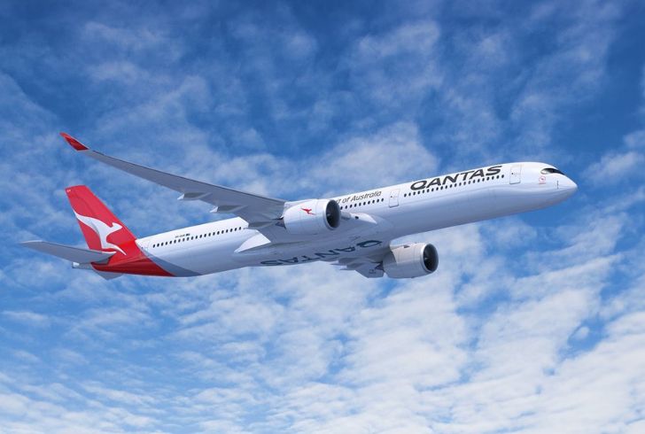 Qantas Airbus A350-1000 flying over Sydney skyline